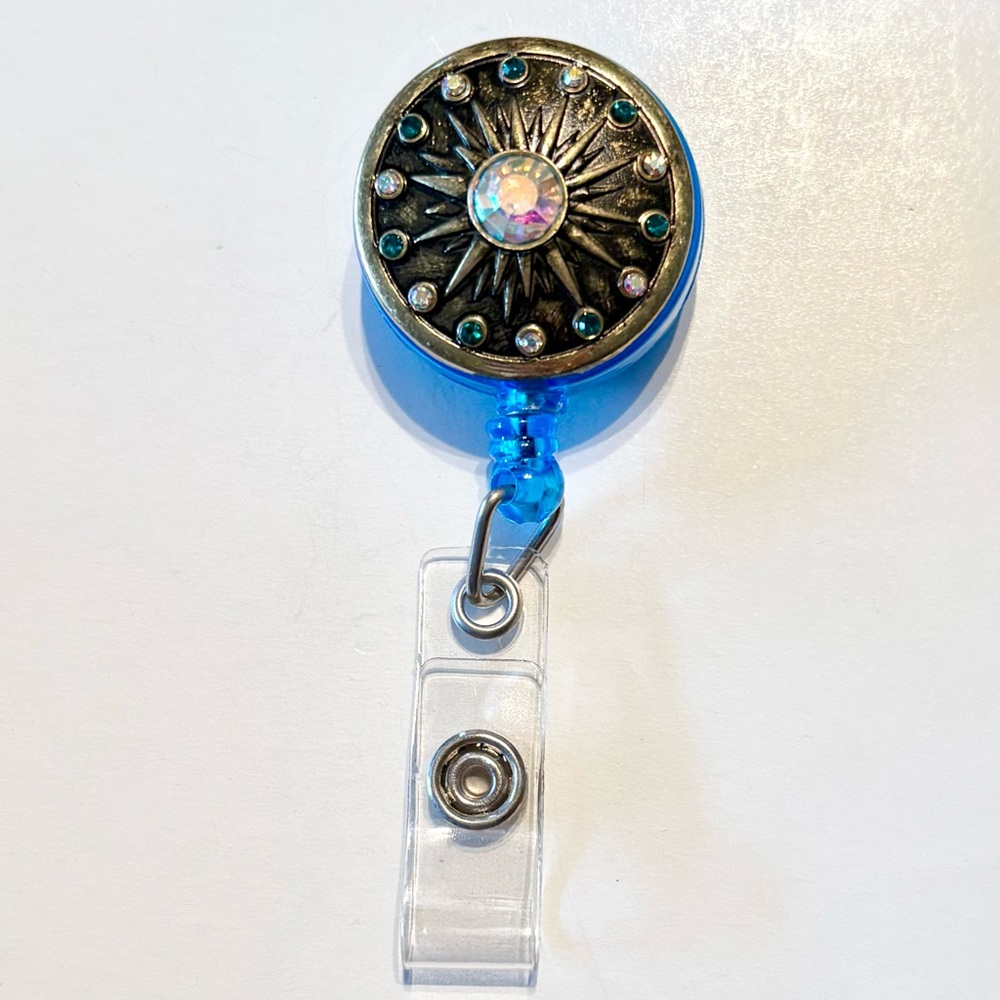 Retractable badge holder